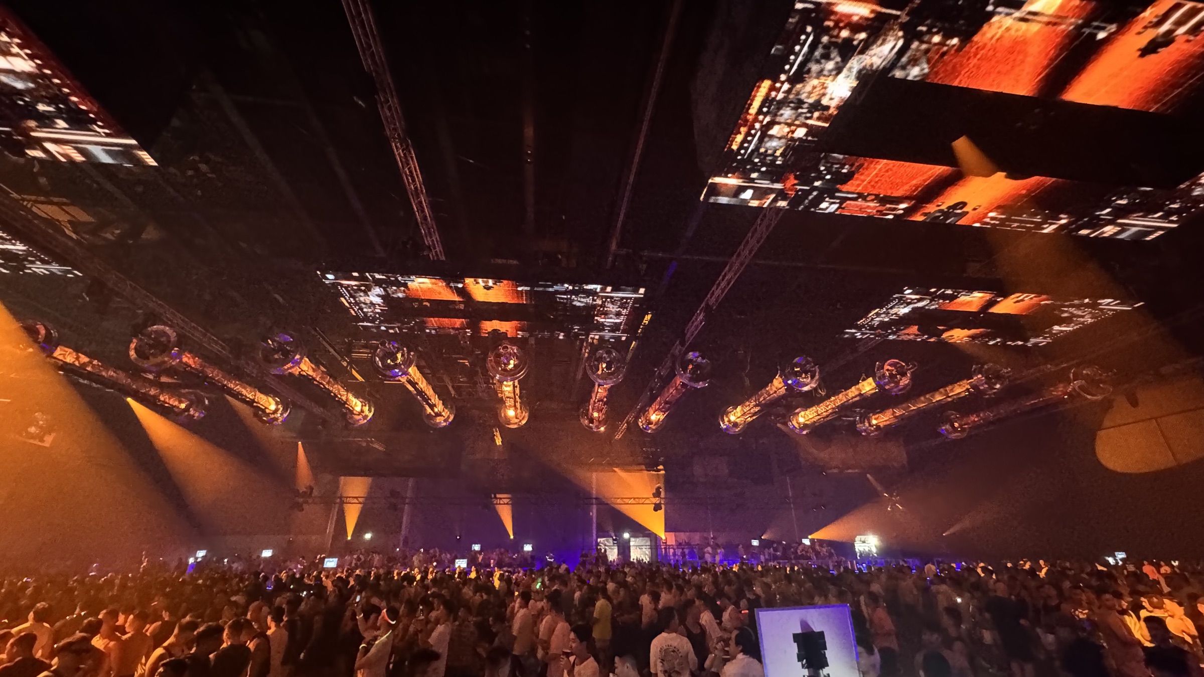 Stage lights over festival crowd